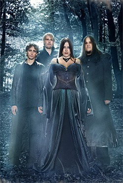 a group of people standing in the woods