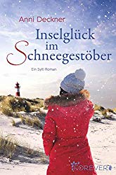 a woman in a red coat and hat standing in snow